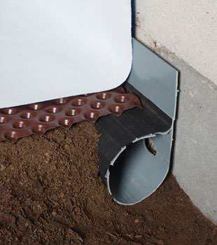 Closeup of a crawl space drainage system installed in Wadmalaw Island