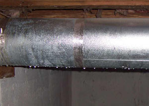 condensation collecting on an HVAC vent in a humid Beaufort basement